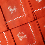 Parandeh Napkins in Cream on Rust